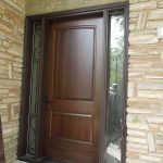 Wood door with vinyl frame