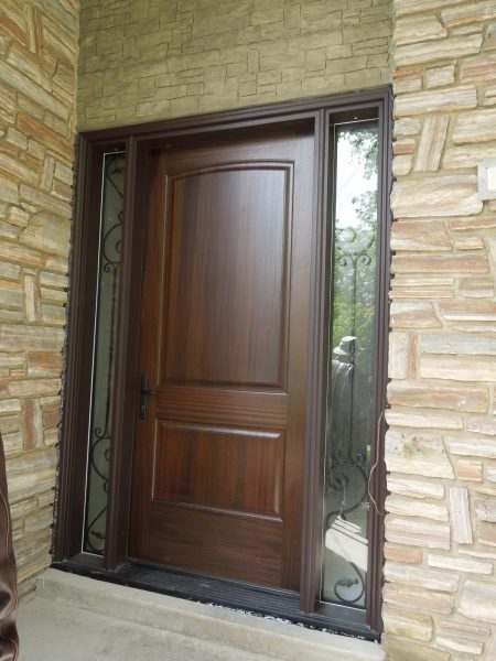 Wood door with vinyl frame